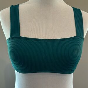 Teal bikini top with wide straps.